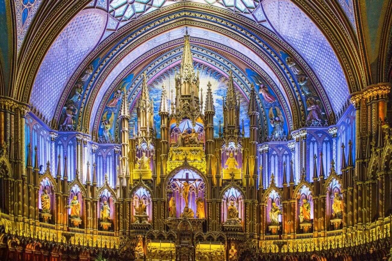 Colorful ornate church interior with stained glass.