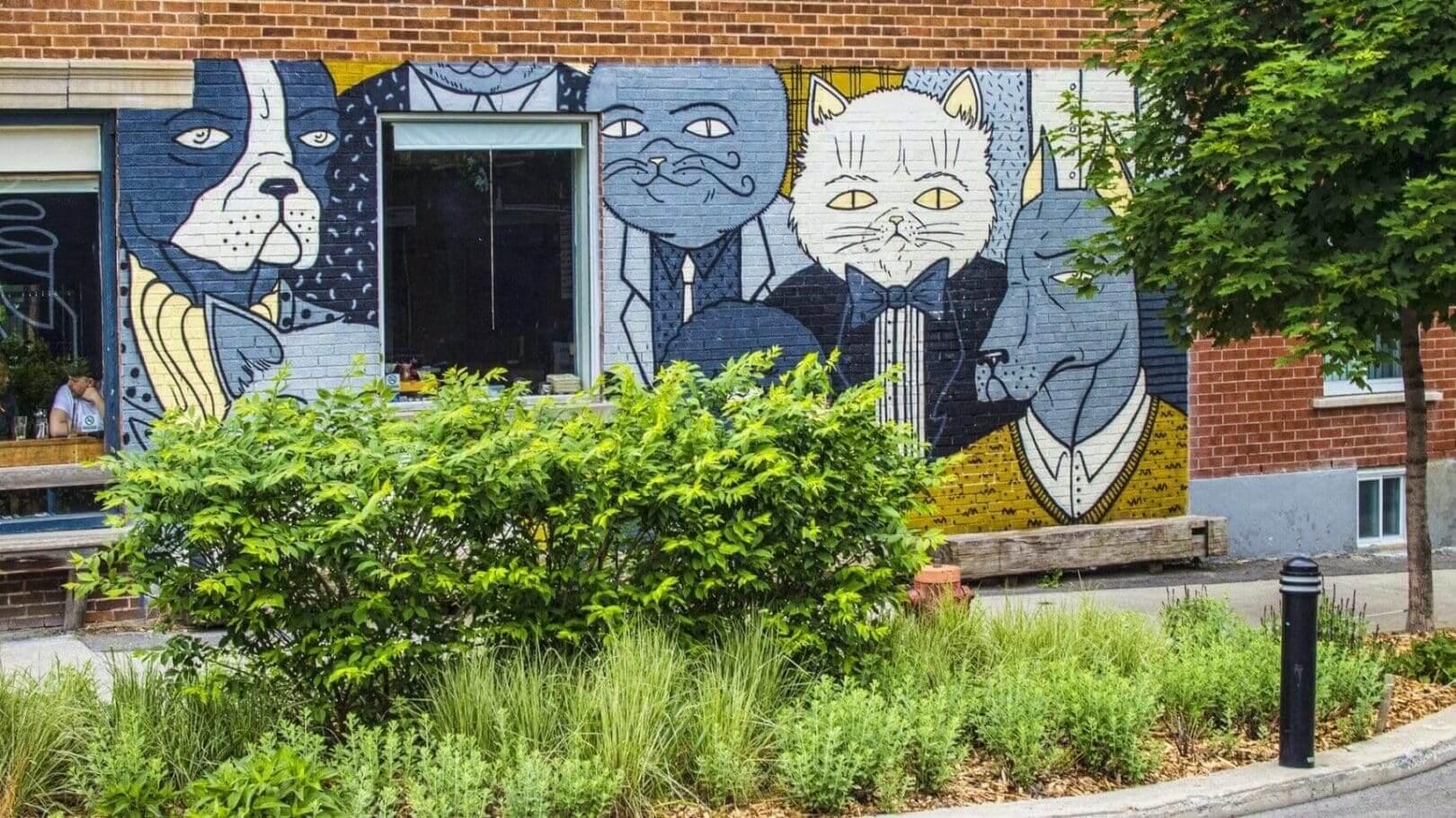 Street art of animals in suits mural.